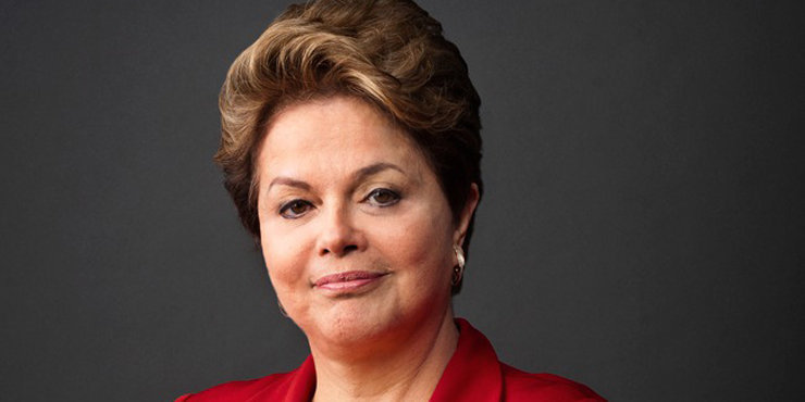 Dilma Rousseff lights the Olympic torch.