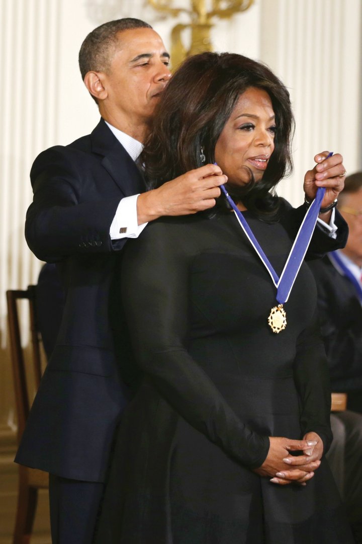 Ex president Barack Obama awarding Oprah the Medal Of Freedom