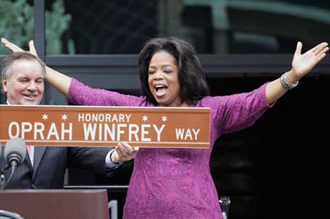 Oprah seems damn happy when the Mayor, Richard Daley renamed blacoks in front of Harpo Studios, Oprah Winfrey Way