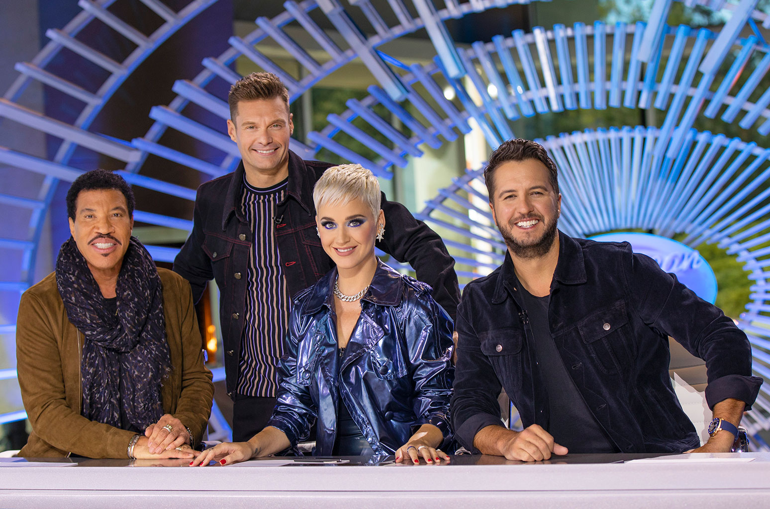 Katy Perry, Lionel Richie & Luke Bryan sitting on judges chairs in American Idol  