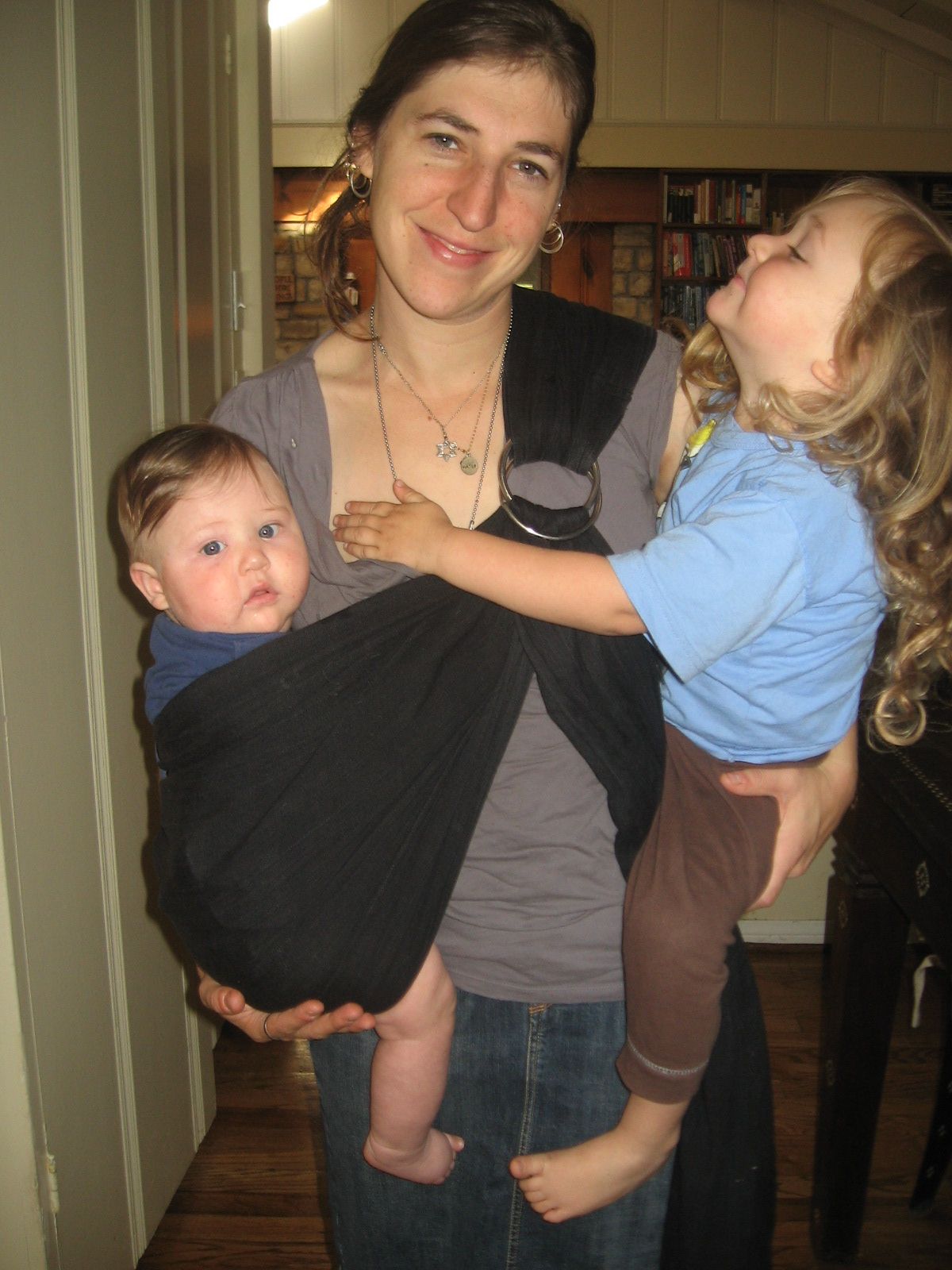 Mayim Biailik holding her two adorable sons