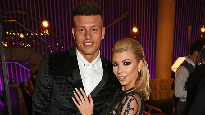 Alex Bowen and wife Olivia Buckland stand for a picture during an event.