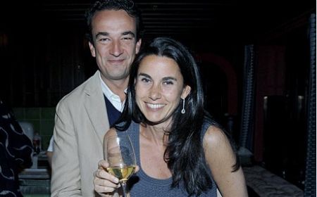 Olivier Sarkozy and his ex-wife Charlotte Bernard pose for a picture.