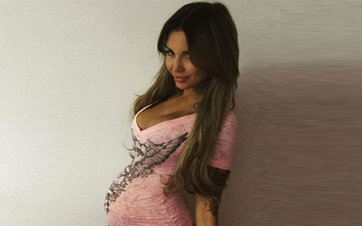 Sallie Axl shows off her pregnant body in a gold bikini.